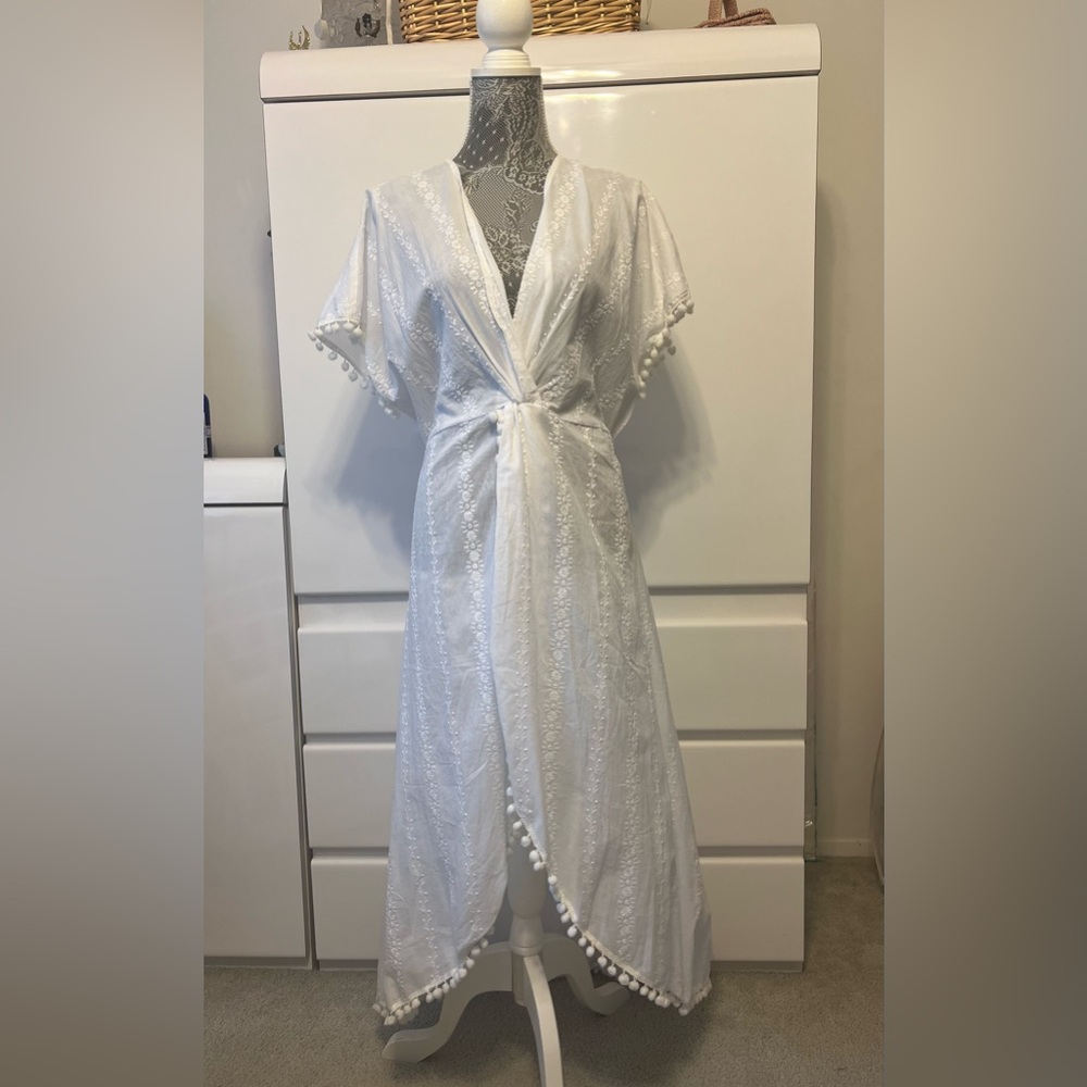 Brand new White high/low eyelet top with pompom trim
